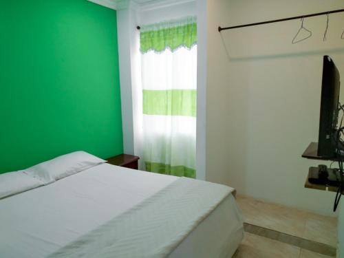 Ένα ή περισσότερα κρεβάτια σε δωμάτιο στο Roxi's Place