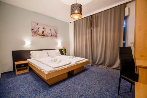 a hotel room with a bed and a window at Rooms Split in Split