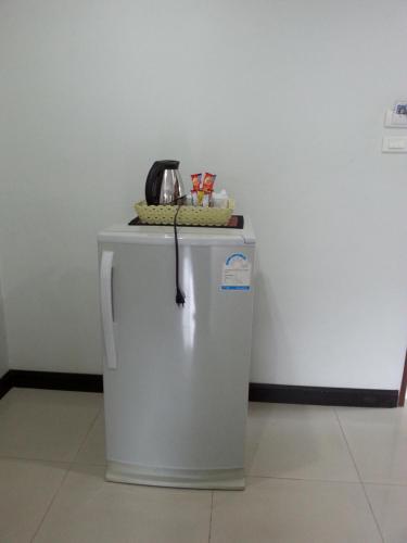 a telephone is sitting on top of a refrigerator at C.A.P Mansion in Phuket Town