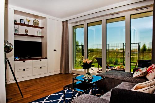 Televisyen dan/atau pusat hiburan di BlueApart Apartamenty Na Plaży Jastarnia