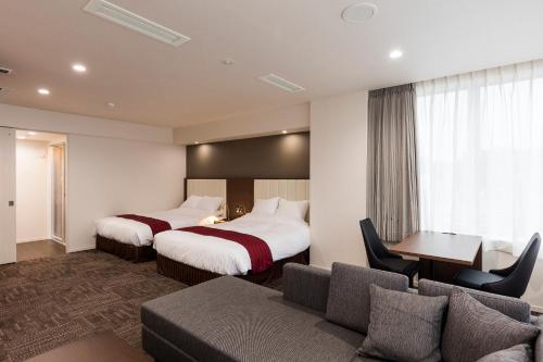 Katil atau katil-katil dalam bilik di Hotel Gran Cerezo Kagoshima