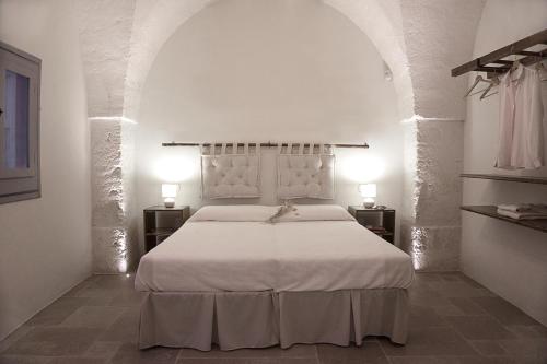 Ένα ή περισσότερα κρεβάτια σε δωμάτιο στο Masseria Capece