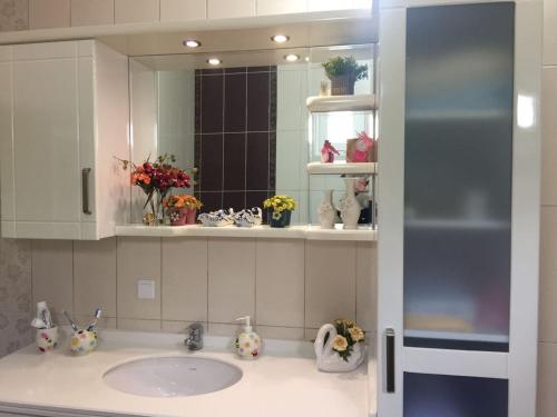 a bathroom with a sink and a mirror at Canim Villa in Trabzon