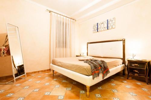 A bed or beds in a room at Casa Vacanze Polifemo