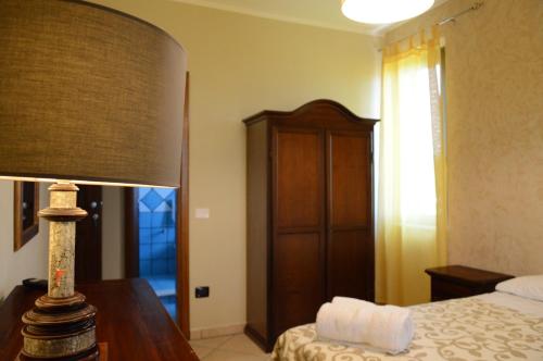 Postel nebo postele na pokoji v ubytování Villa D'Aquino