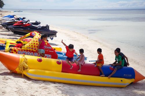 a group of children playing on a inflatableescription at Tropical Fun Ta Sea Rentals in Siquijor