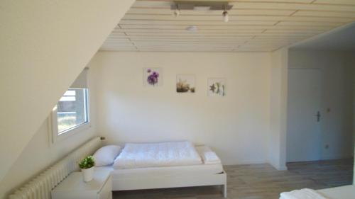 a white room with a couch and a window at GL 234 in Bergisch Gladbach