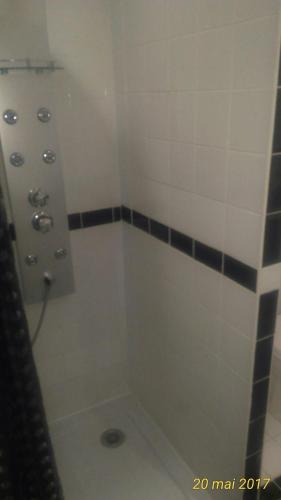 a bathroom with a shower with a sink and a shower at Au QUATRE, 2em étage centre historique in Pézenas