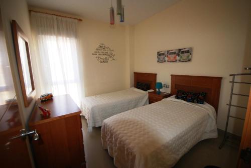 En eller flere senge i et værelse på Casa Joca Pueblo