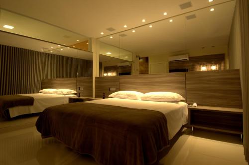 En eller flere senge i et værelse på Le Ville