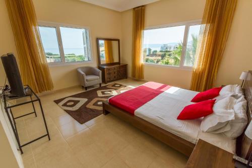 A bed or beds in a room at Villa Riverside