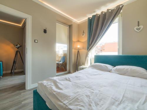 Posteľ alebo postele v izbe v ubytovaní Apartament 617 w Hotelu Polonia