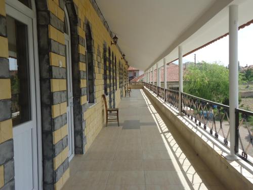 an empty hallway of a building with a balcony at Akar Hotel in Ihlara