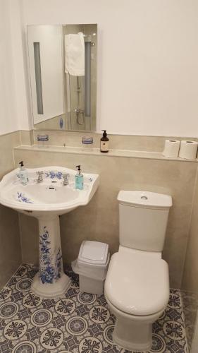 a bathroom with a toilet and a sink at The Lodge Harrogate in Harrogate