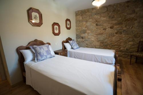 Ένα ή περισσότερα κρεβάτια σε δωμάτιο στο Casa o Leiteiro