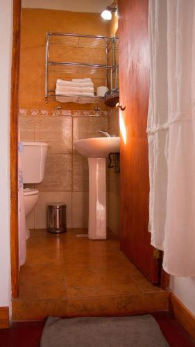 a bathroom with a sink and a toilet at Divina Presencia in Cafayate