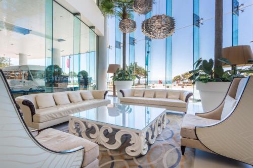 a lobby with couches and a table and chairs at Holiday Holiday Soul Apartments in Gold Coast