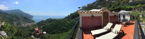 a building sitting on top of a mountain at Casa Rossa in Ravello
