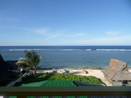 a view of the ocean from the balcony of a resort at Sailfishbay Surf And Big Game Fishing Lodge in San Isidro