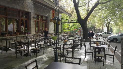 a group of tables and chairs outside of a restaurant at Hani Zemenou in Arachova