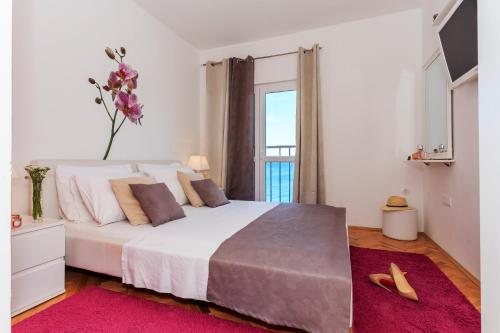 Posteľ alebo postele v izbe v ubytovaní Seaside Ante Apartments