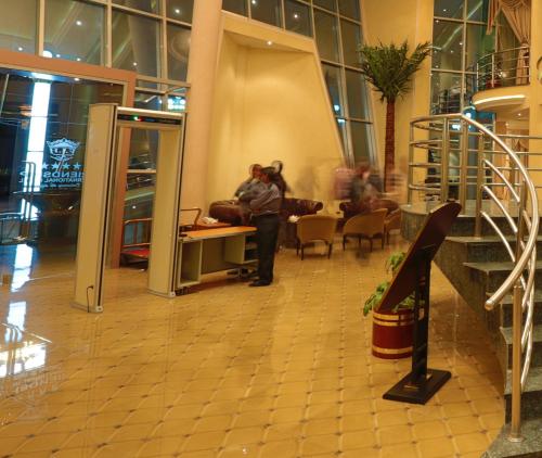 a person standing in a lobby of a building at Friendship International Hotel in Addis Ababa