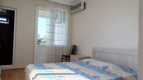 Postel nebo postele na pokoji v ubytování Mari Guest House