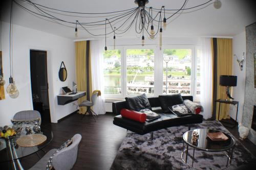 a living room with a couch and a table at Moselapart in Cochem
