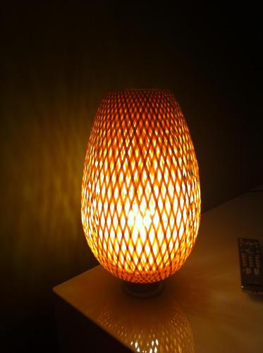a orange lamp sitting on top of a table at Appartamento in centro storico in Asti