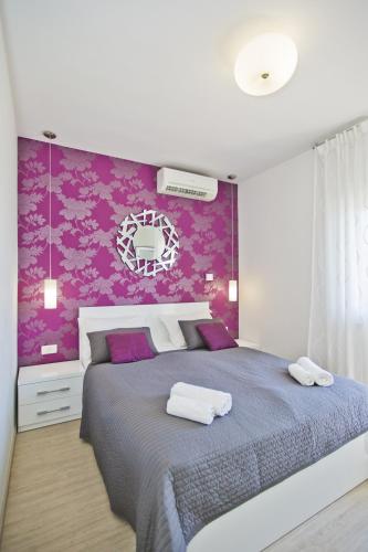 Una cama o camas en una habitación de Violeta Hvar