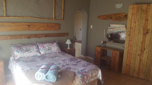 Postel nebo postele na pokoji v ubytování Thandamanzi Self Catering