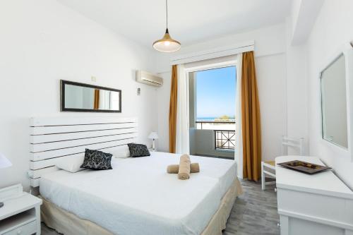 Postel nebo postele na pokoji v ubytování Castello Bianco Aparthotel