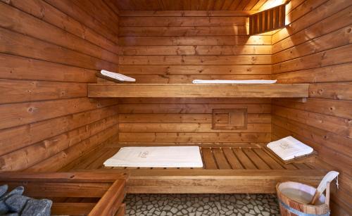 a wooden sauna with a bed in it at Hotel Rocca Della Sena in Tropea