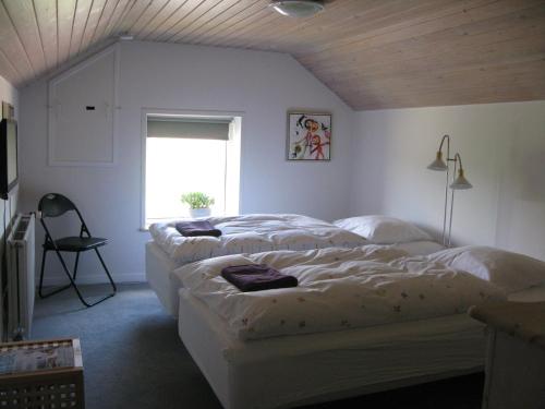 Tempat tidur dalam kamar di Sysselbjerg Bed & Breakfast