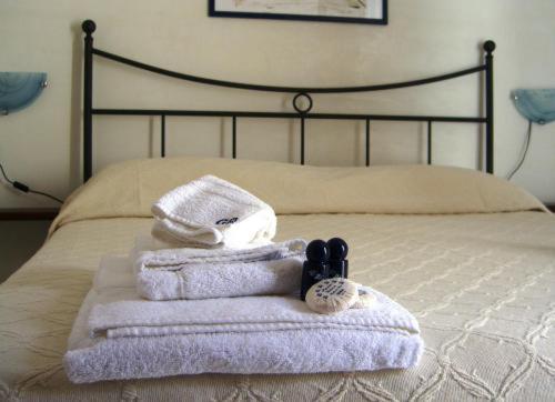 Кровать или кровати в номере La Plaza Residence Levanzo
