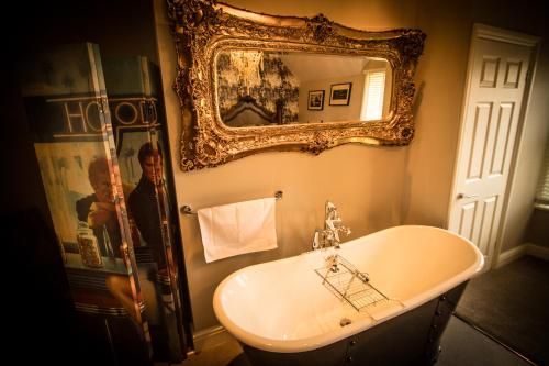 a bathroom with a sink and a mirror at Brockley Hall Hotel in Saltburn-by-the-Sea