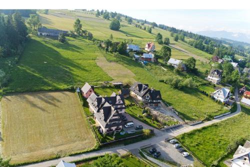 an aerial view of a house on a hill at Pokoje u Borzana in Biały Dunajec