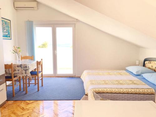Postel nebo postele na pokoji v ubytování Apartment Martinovic