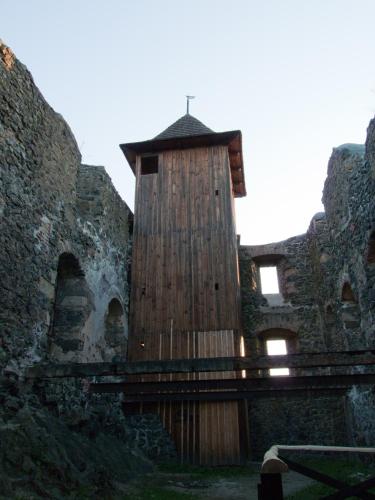 an old building with a wooden tower on the side at Apartment Jakubske Namesti in Česká Kamenice