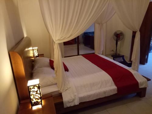 Ένα ή περισσότερα κρεβάτια σε δωμάτιο στο Villa Esa Ubud