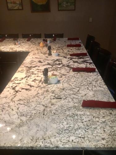 a long table with a white marble counter top at Grafton Lodge in Lake Lure