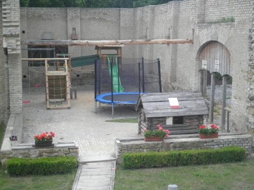 a playground with a blue slide at Penzion Ve stoleti in Loděnice