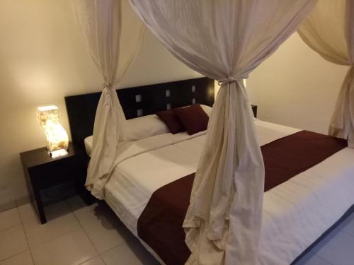 Ένα ή περισσότερα κρεβάτια σε δωμάτιο στο Villa Esa Ubud