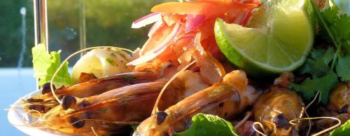 a plate of food with lobster and vegetables on it at Eco Beach Wilderness Retreat in Broome