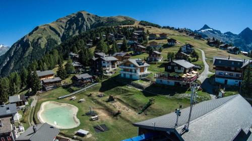 an aerial view of a resort on a mountain at Chalet Gerbera in Rosswald
