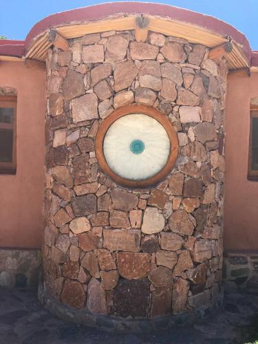 a stone wall with a window on a house at ETERNO SOL Loft Andino in Humahuaca