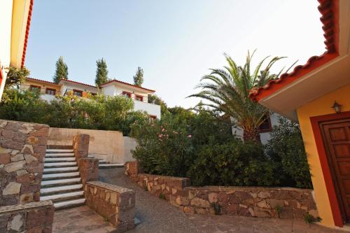 a set of stairs in front of a house at Belvedere Aeolis Hotel in Mithymna