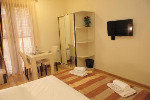 Postel nebo postele na pokoji v ubytování Daniel Boutique Hotel