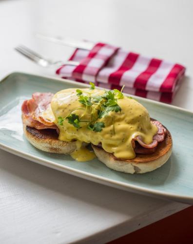 a plate with two breakfast sandwiches with cheese and ham at Buccleuch Arms in Saint Boswells