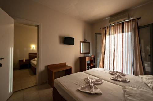 Ένα ή περισσότερα κρεβάτια σε δωμάτιο στο Hotel Sias Resort